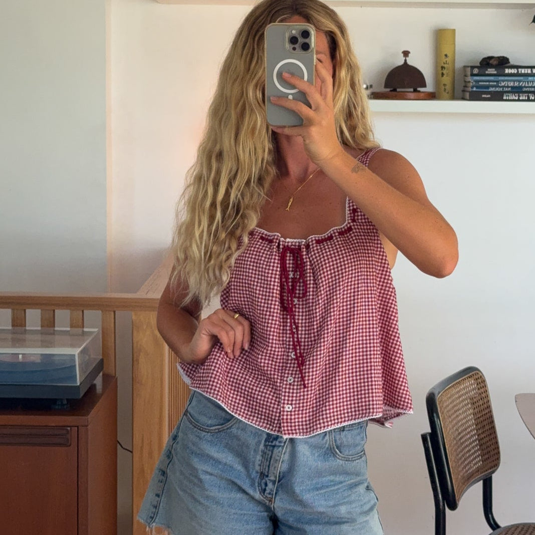 Red gingham top with denim shorts outfit