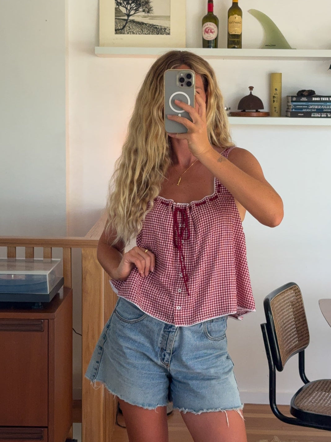 Red gingham top with denim shorts outfit
