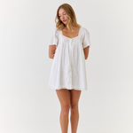 White mini dress in breathable cotton with soft feminine detailing