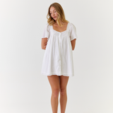 White mini dress in breathable cotton with soft feminine detailing